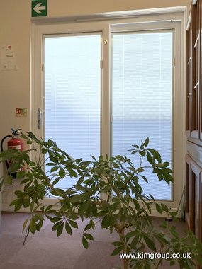 White integral blind in a sliding patio door